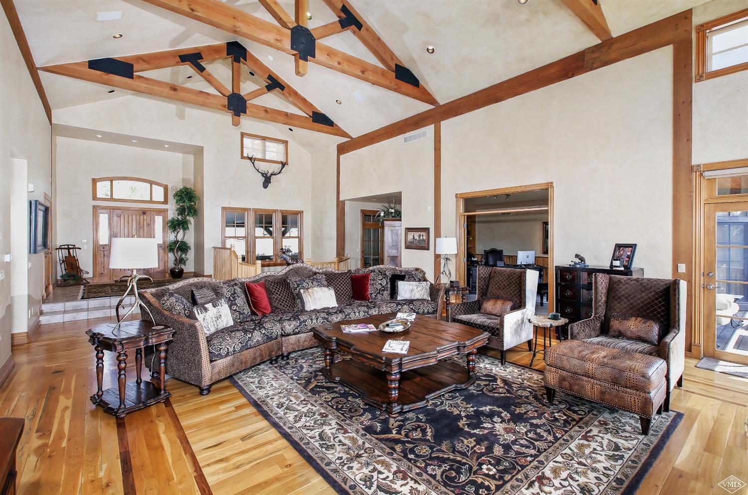 142 Spring Creek Lane Edwards, CO 81632 - Photo 5 of 25 a living room with furniture wooden floor and a table