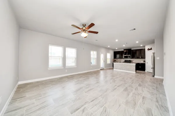 a view of kitchen with cabinets and wooden floor