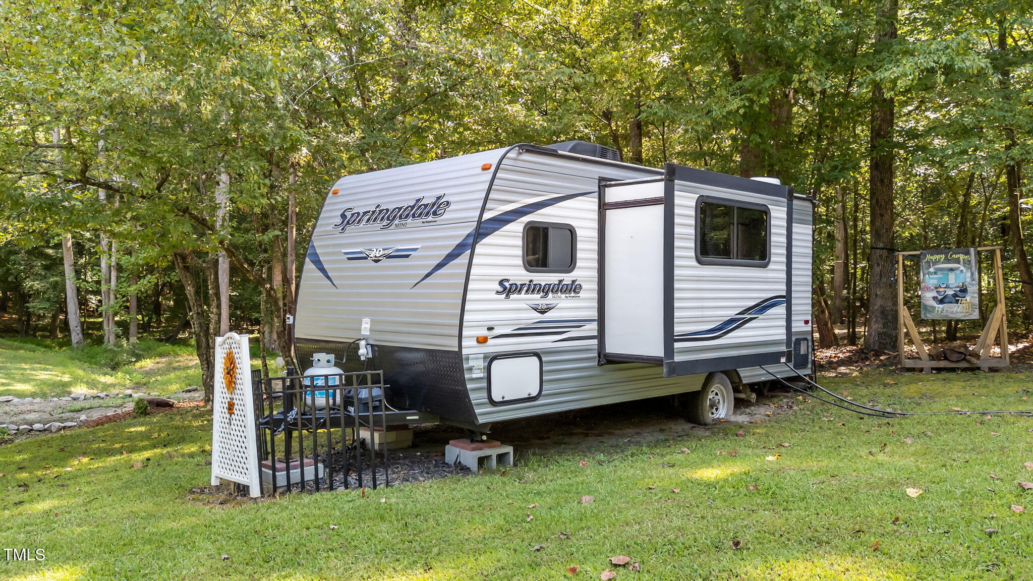 171 Winnebago Loop Louisburg, NC 27549 - Photo 12 of 32 a view of a small house with a yard
