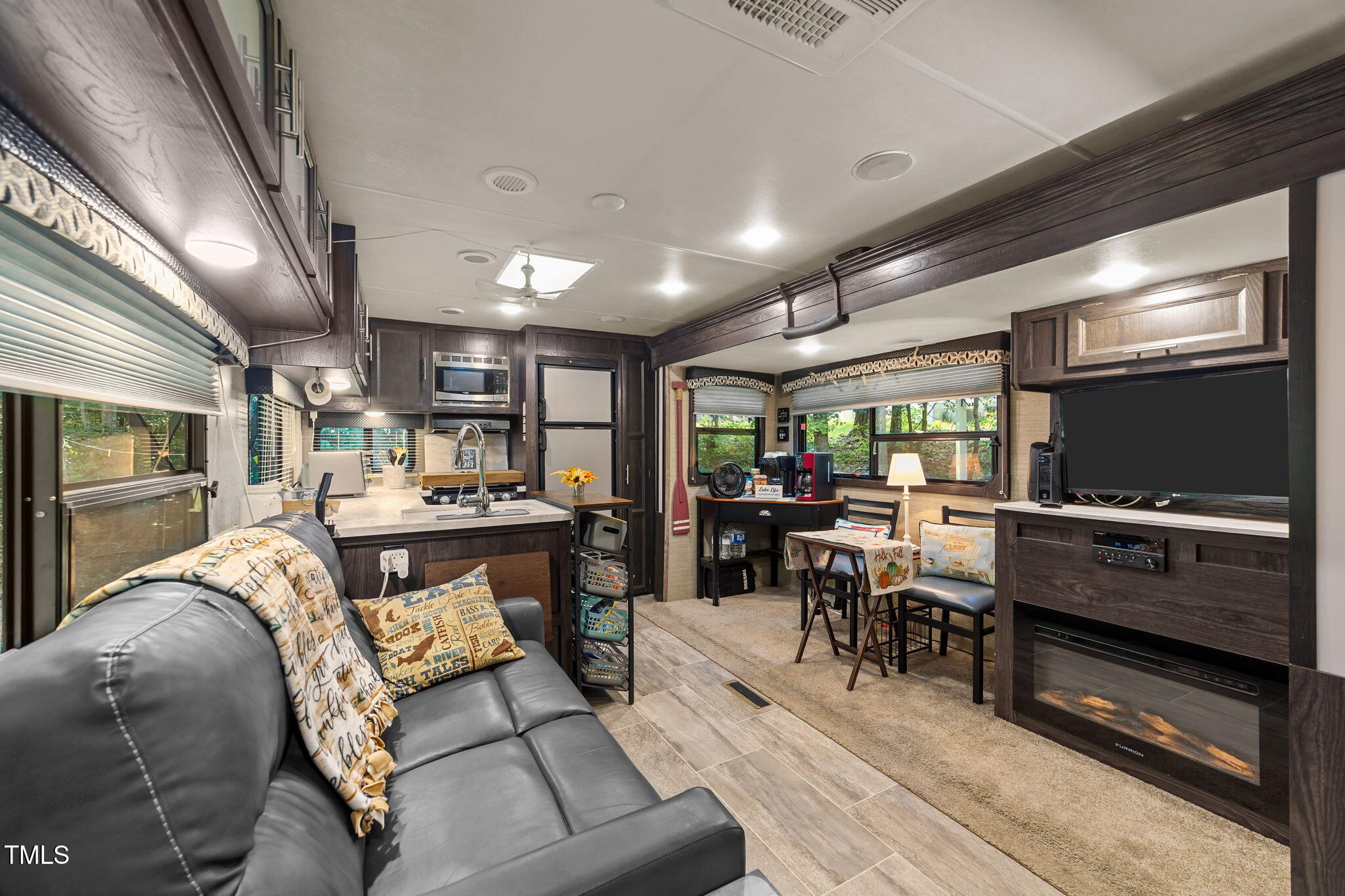 171 Winnebago Loop Louisburg, NC 27549 - Photo 18 of 32 a living room with lots of furniture and kitchen view