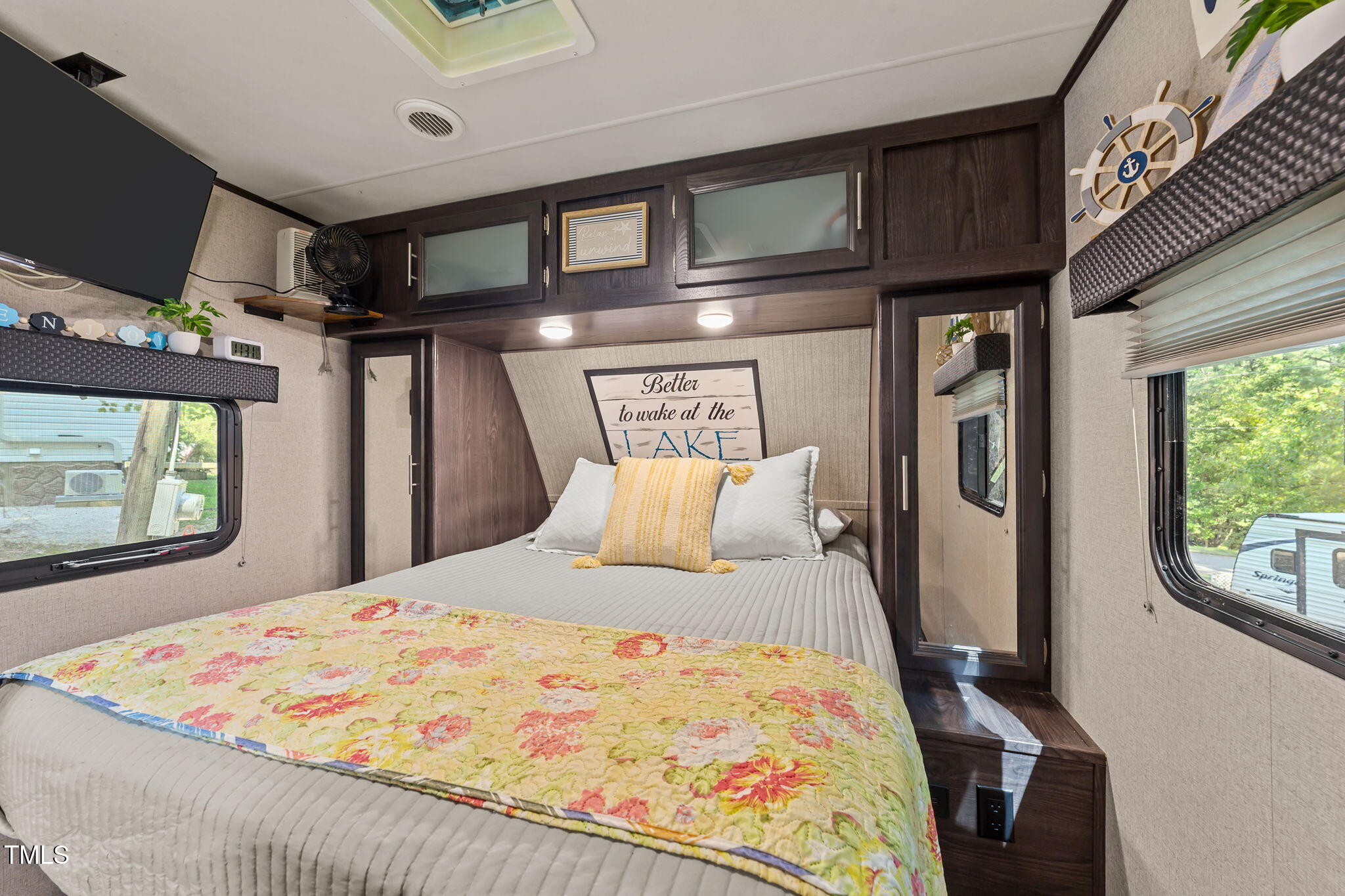 171 Winnebago Loop Louisburg, NC 27549 - Photo 23 of 32 a bed sitting in a bedroom next to a window