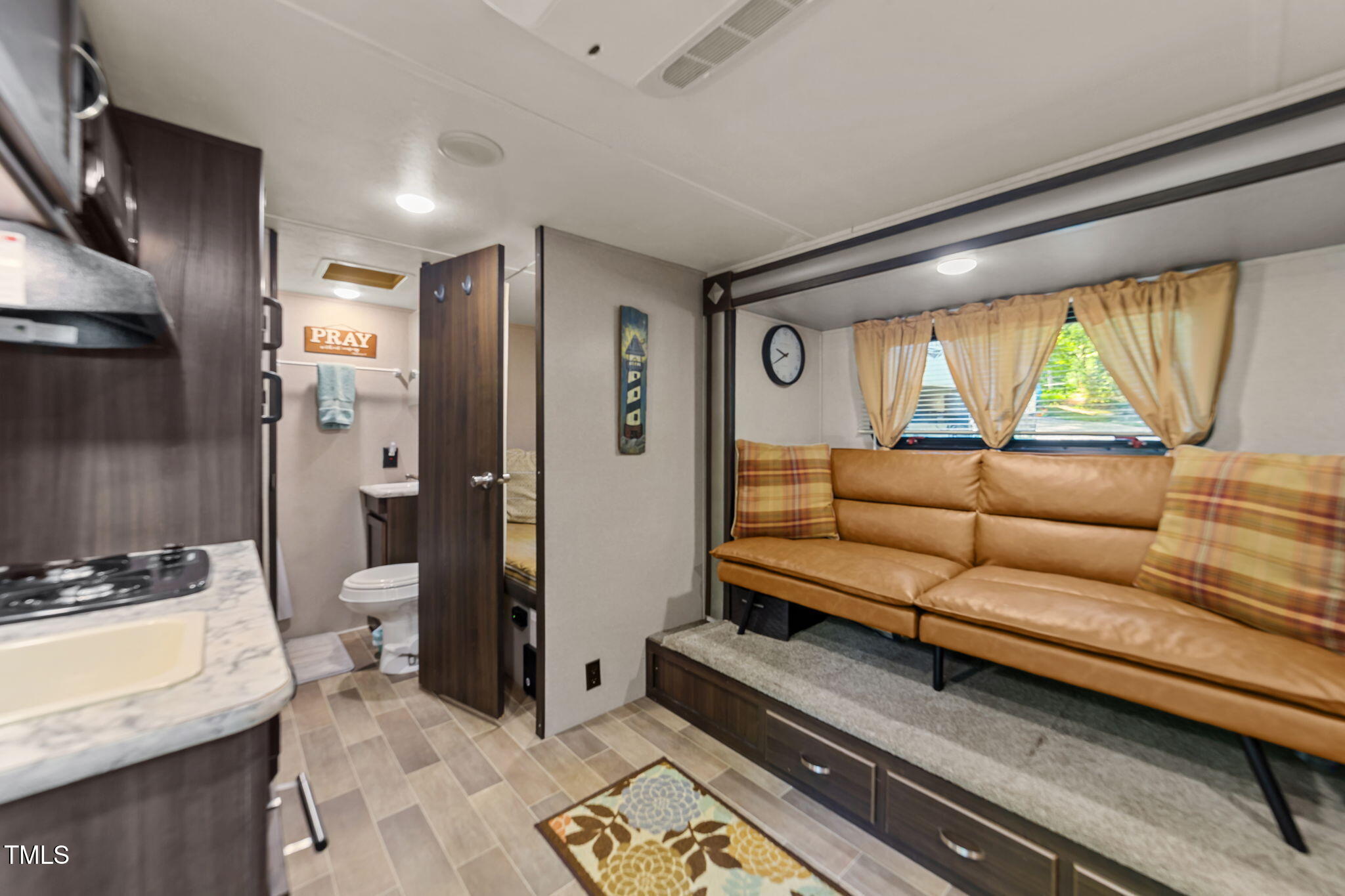 171 Winnebago Loop Louisburg, NC 27549 - Photo 25 of 32 a living room with furniture and a large window