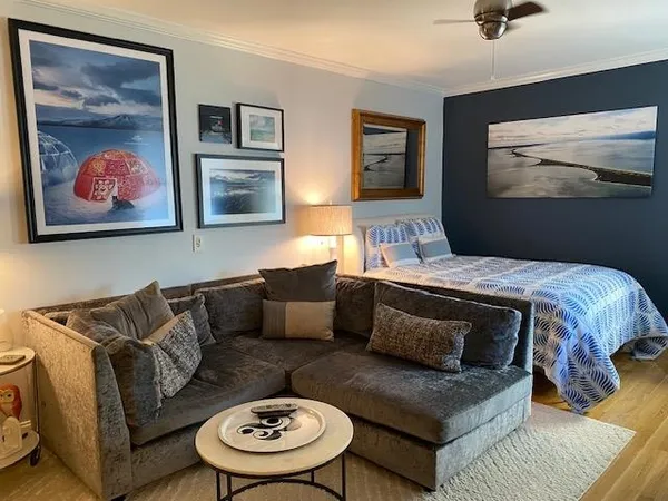 a living room with furniture and a flat screen tv