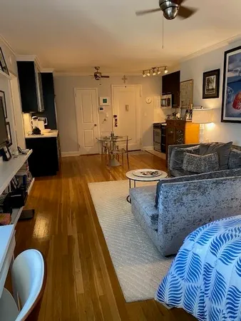 a view of living room with furniture and flat screen tv