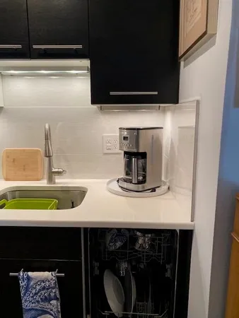 a room with wooden floor and furniture