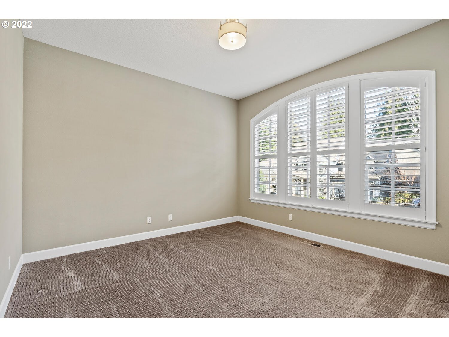 6117 Southwest 67th Place Portland, OR 97223 - Photo 18 of 32 a view of an empty room with a window