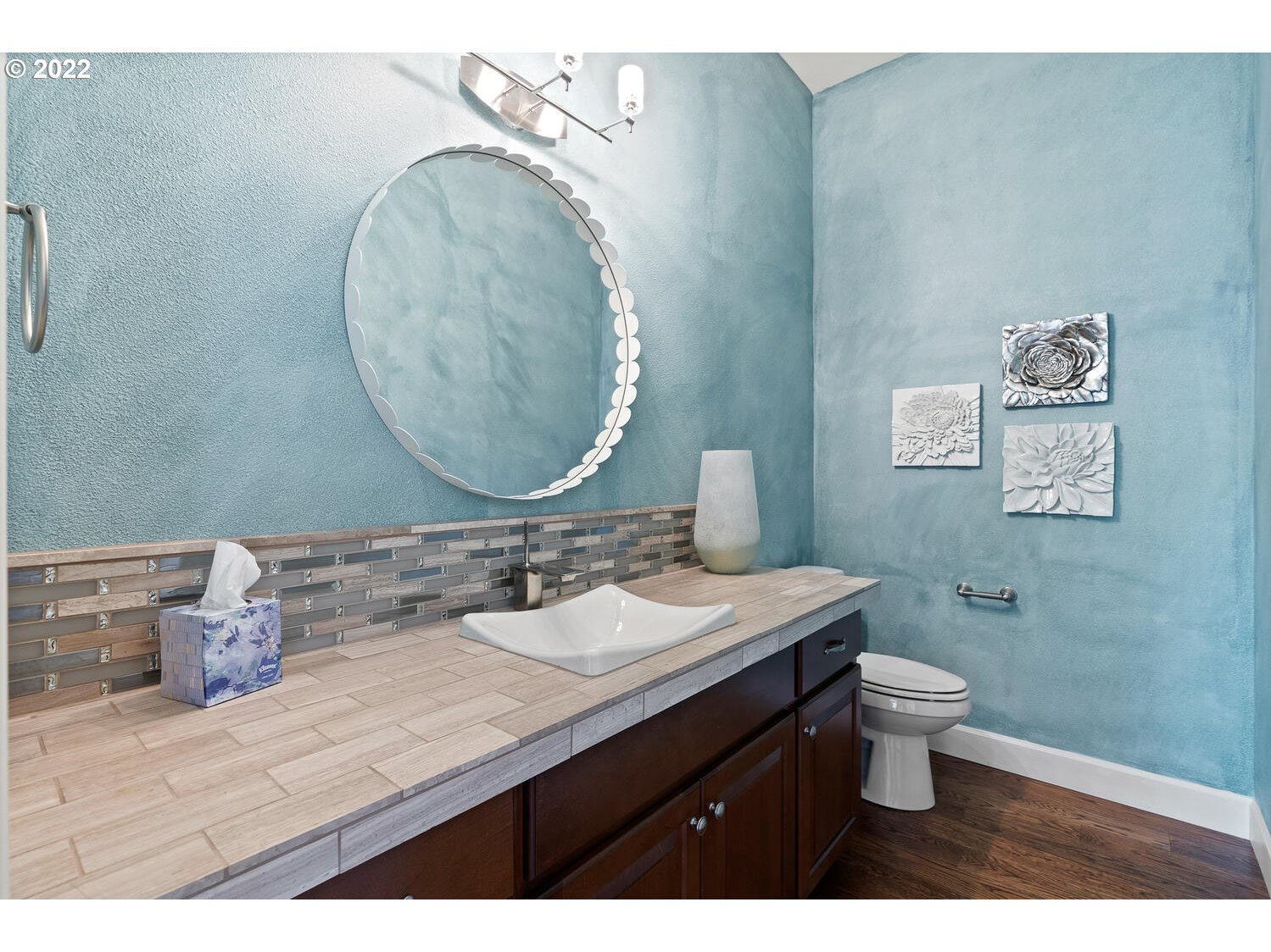 6117 Southwest 67th Place Portland, OR 97223 - Photo 20 of 32 a bathroom with a granite countertop toilet sink and mirror