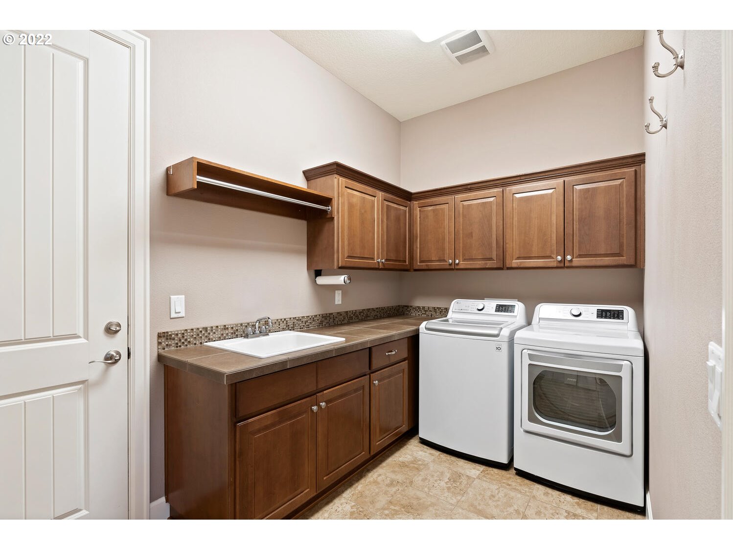 6117 Southwest 67th Place Portland, OR 97223 - Photo 21 of 32 a utility room with dryer and washer