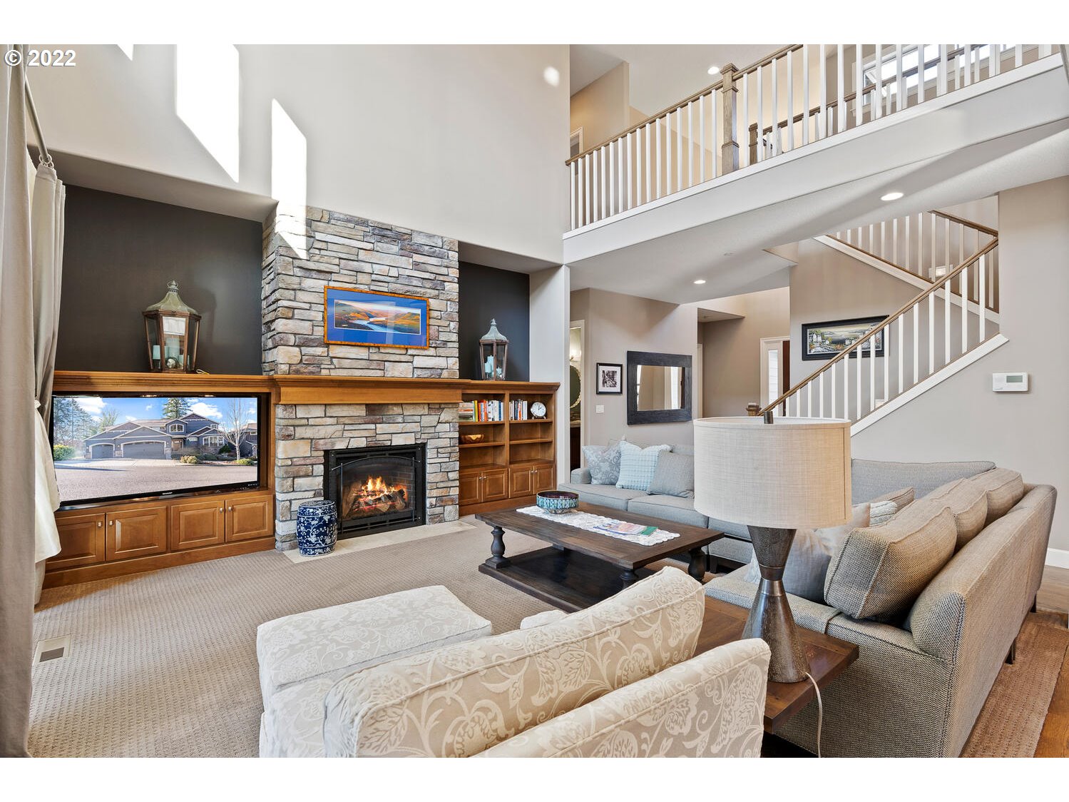 6117 Southwest 67th Place Portland, OR 97223 - Photo 6 of 32 a living room with furniture and a fireplace