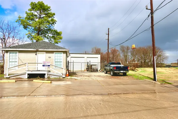 a view of a house with swimming pool and sitting area with furniture