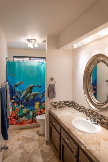 644 Beth Lane Ridgecrest, CA 93555 - Photo 12 of 31 a bathroom with a sink mirror and toilet