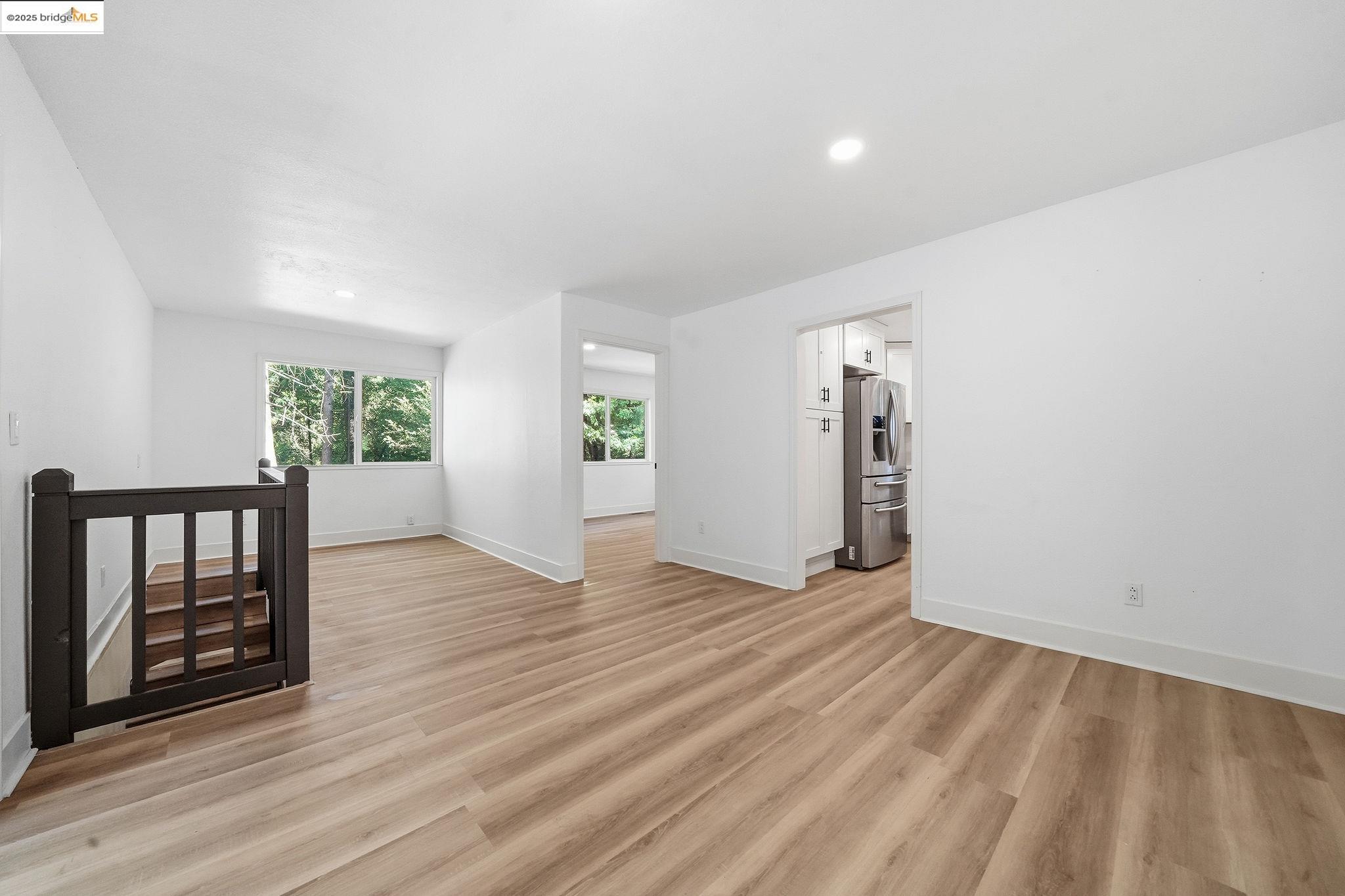 23656 Lightning Pioneer, CA 95666 - Photo 12 of 32 an empty room with wooden floor and windows