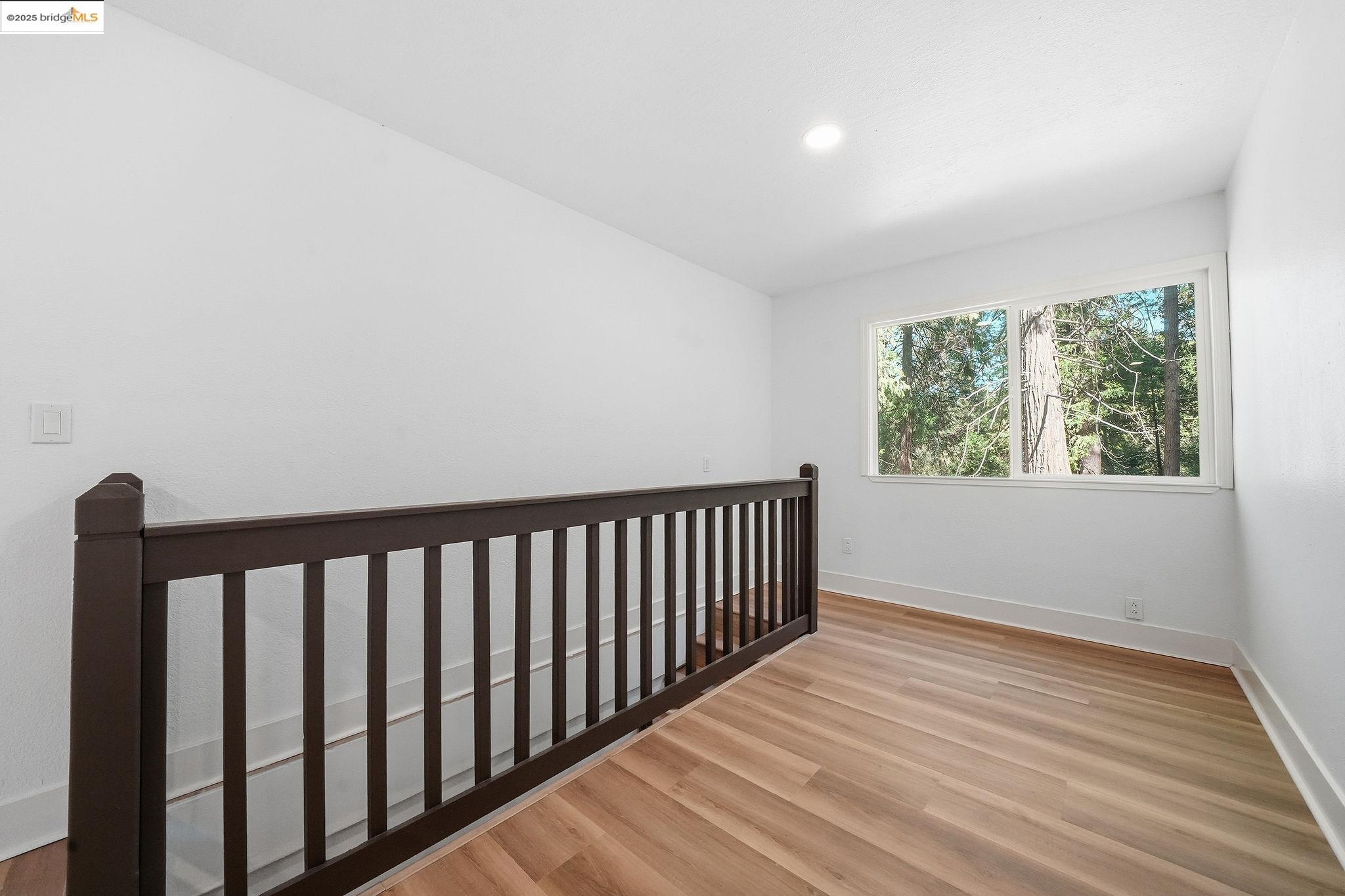 23656 Lightning Pioneer, CA 95666 - Photo 13 of 32 a view of a hallway with wooden floor and a window
