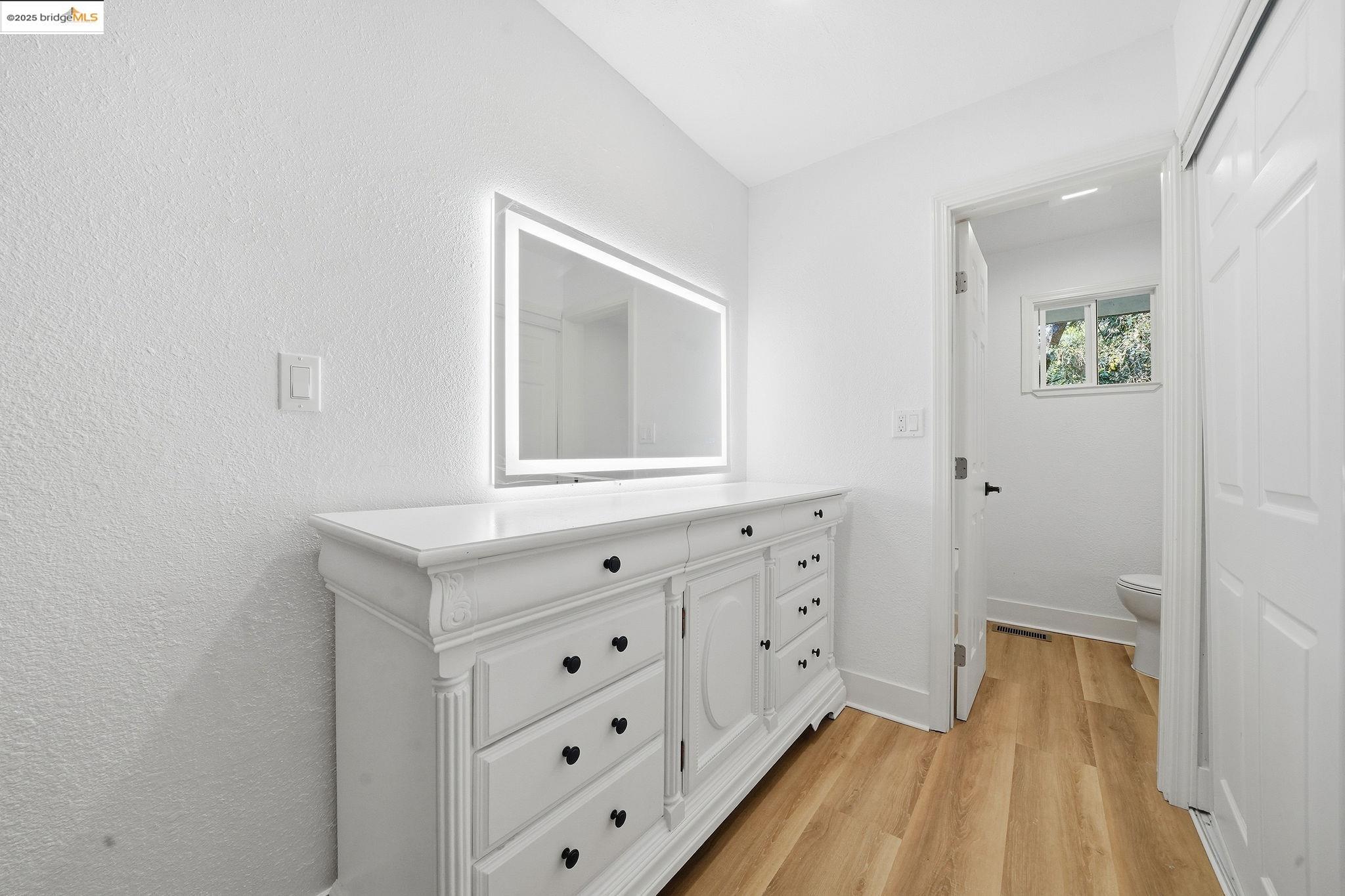 23656 Lightning Pioneer, CA 95666 - Photo 17 of 32 a room with cabinet a mirror and vanity