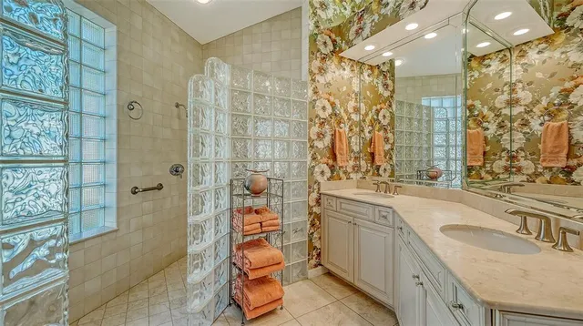 a bathroom with 2 sink and a mirror