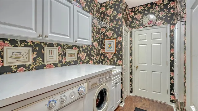 a view of balcony with furniture and potted plants