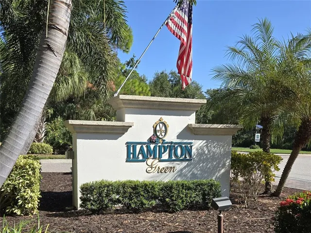 a view of a lake with houses in the back