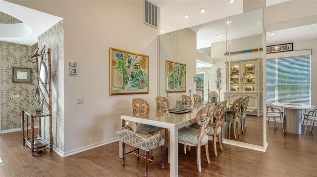 a view of a dining room with furniture window and wooden floor
