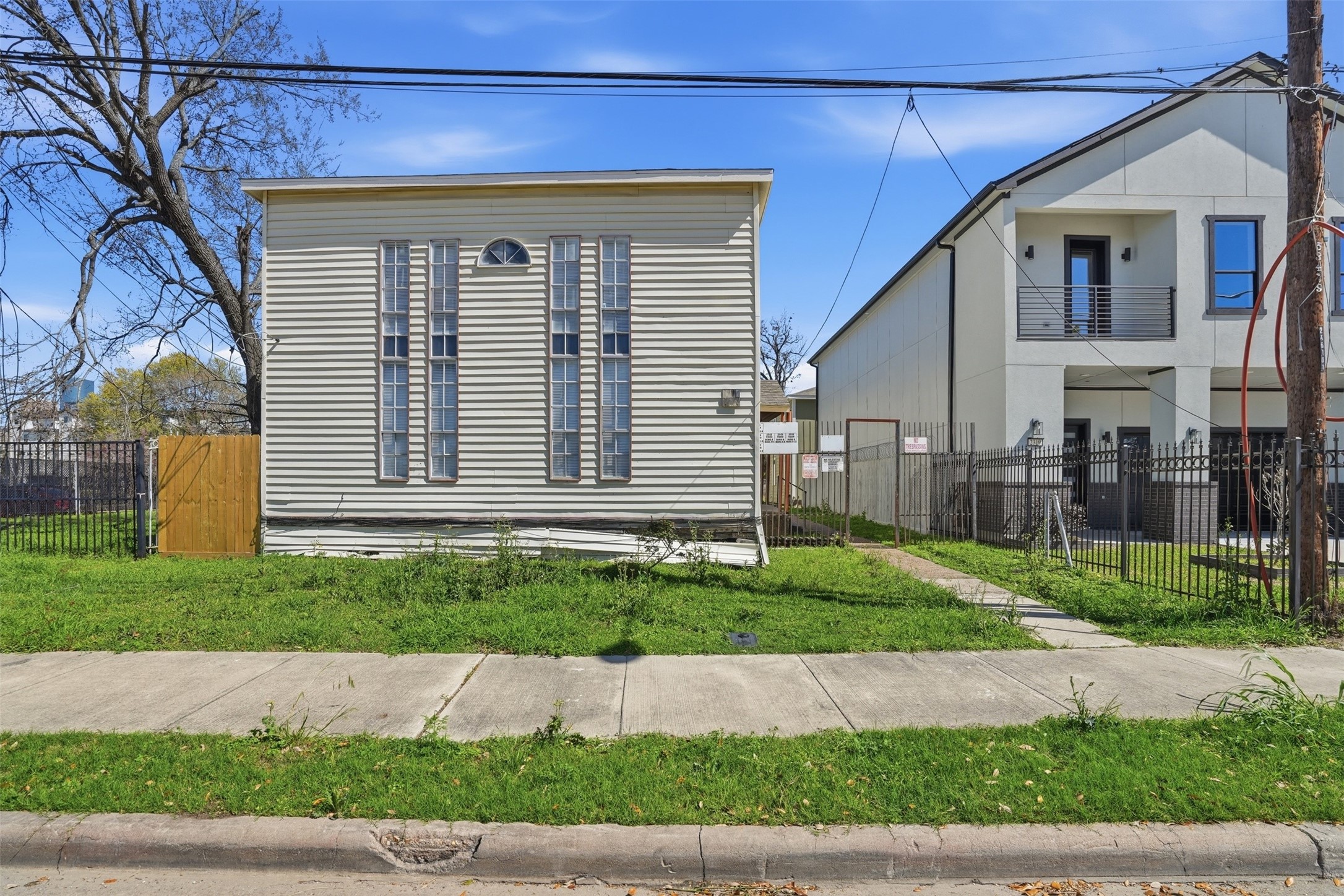 2307 Tuam Street Houston, TX 77004 - Photo 10 of 16 a front view of a house with a yard and garage