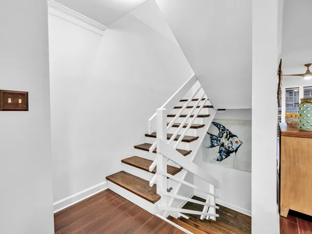 a bathroom with a toilet a sink and a mirror