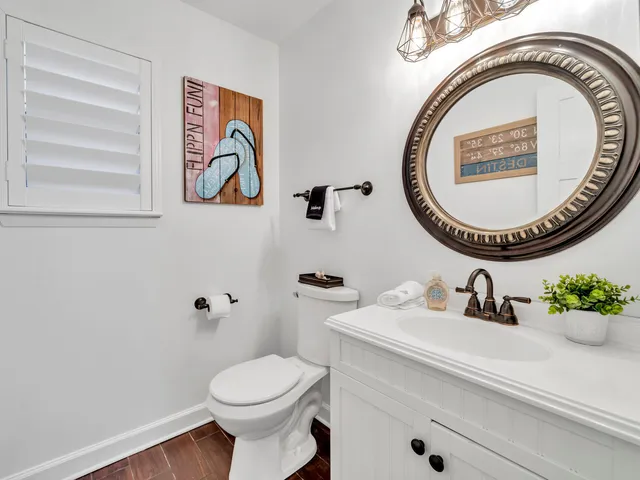 a kitchen with stainless steel appliances granite countertop a sink a stove a refrigerator a microwave with a dining table and chairs