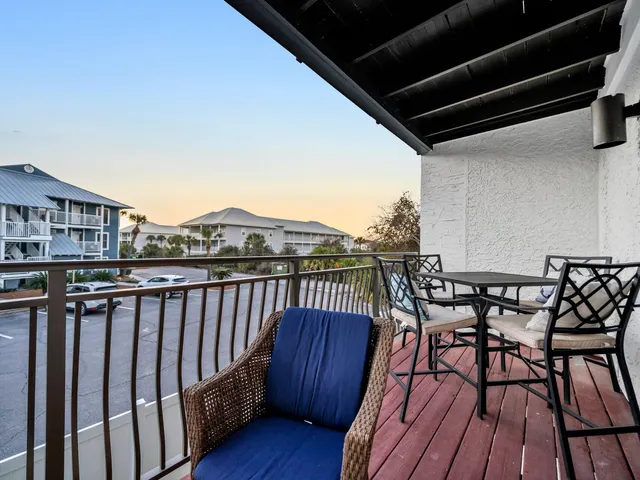 a table and chairs in a balcony