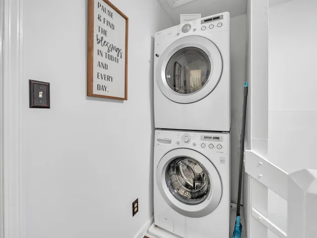 a bed room with a bed and a chair