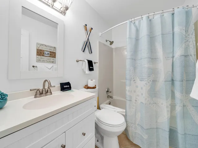 a bedroom with a large bed and a desk