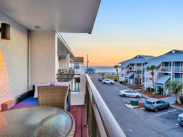 a front view of a house with a garden and plants