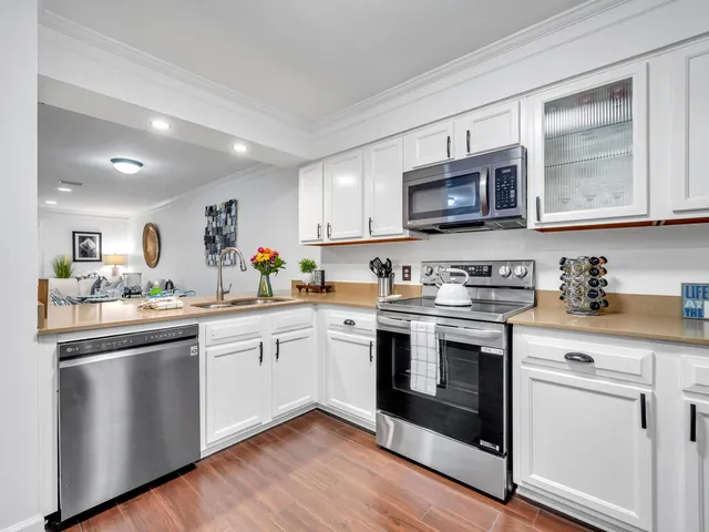 a kitchen with a faucet a sink and a dining table