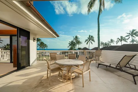 a view of a chairs and table in patio