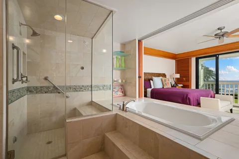 a spacious bedroom with a large bed and a large window