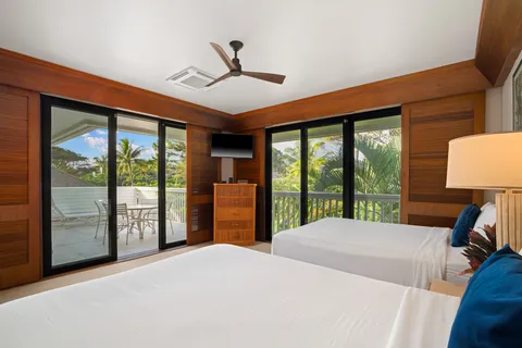 a bedroom with a large bed and a large window