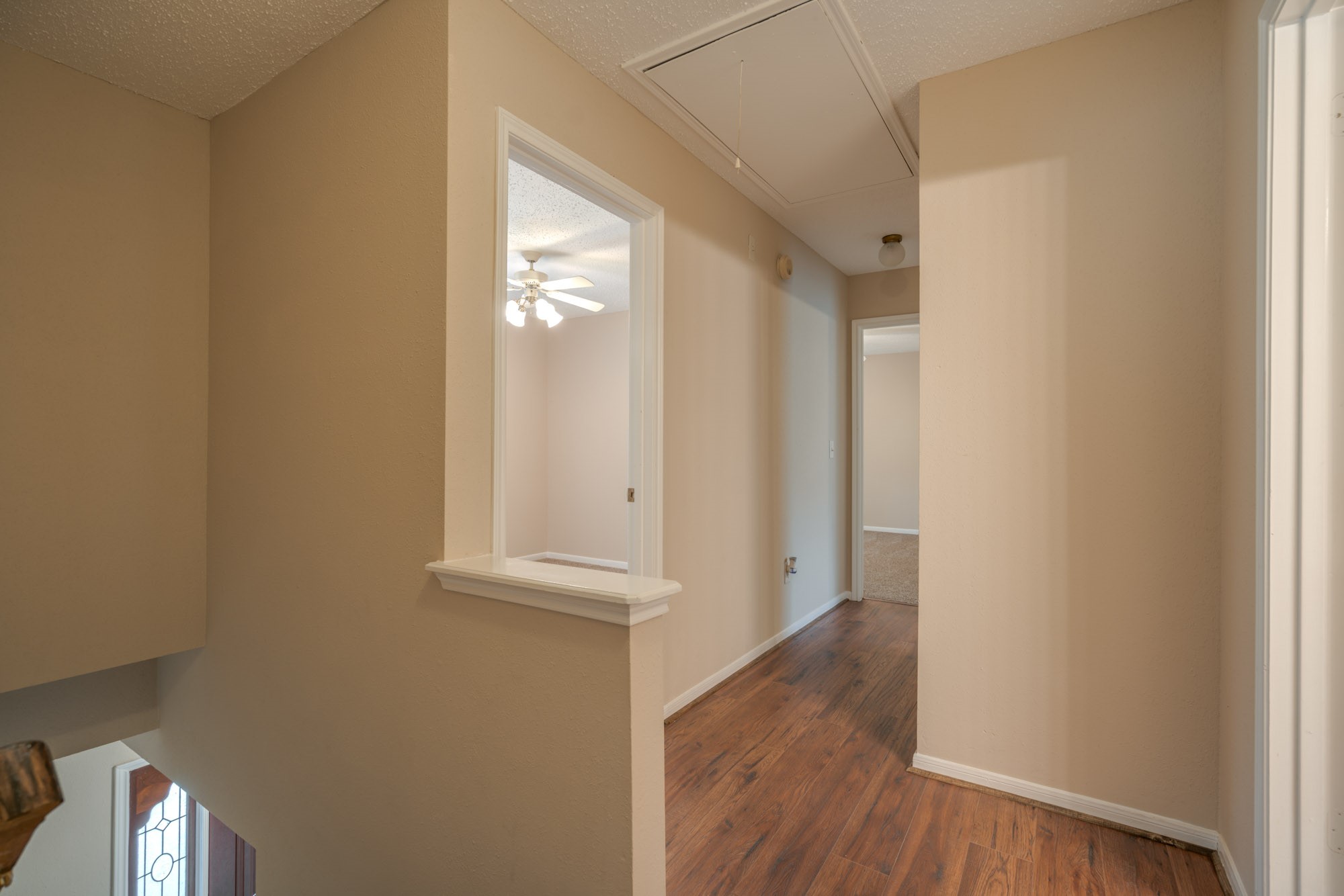 11 Robin Run Drive Spring, TX 77381 - Photo 11 of 25 a view of a hallway with wooden floor