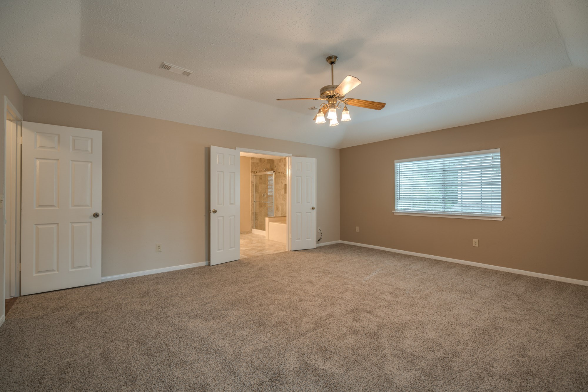 11 Robin Run Drive Spring, TX 77381 - Photo 13 of 25 an empty room with windows and chandelier fan
