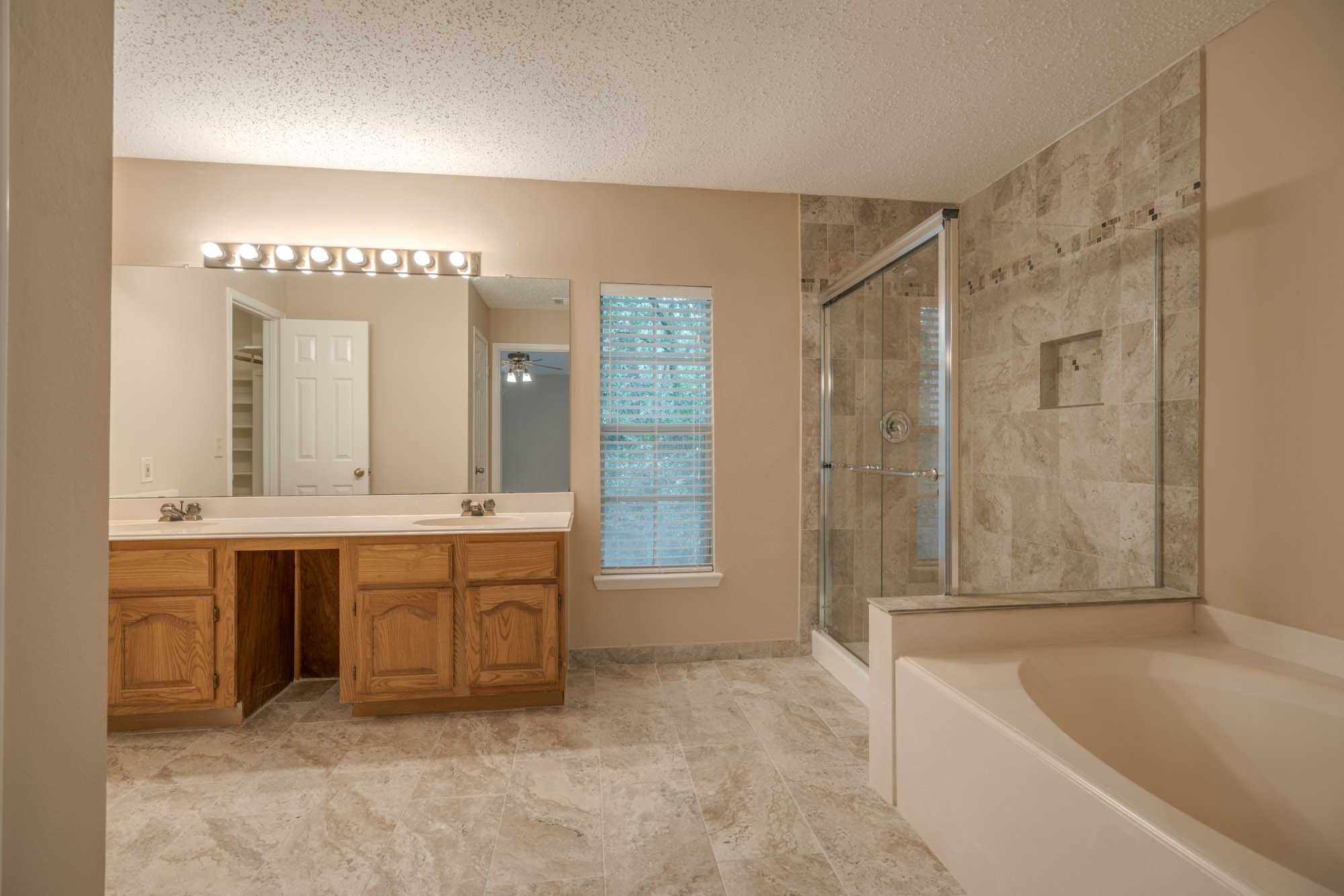 11 Robin Run Drive Spring, TX 77381 - Photo 14 of 25 a spacious bathroom with a tub sink shower and mirror
