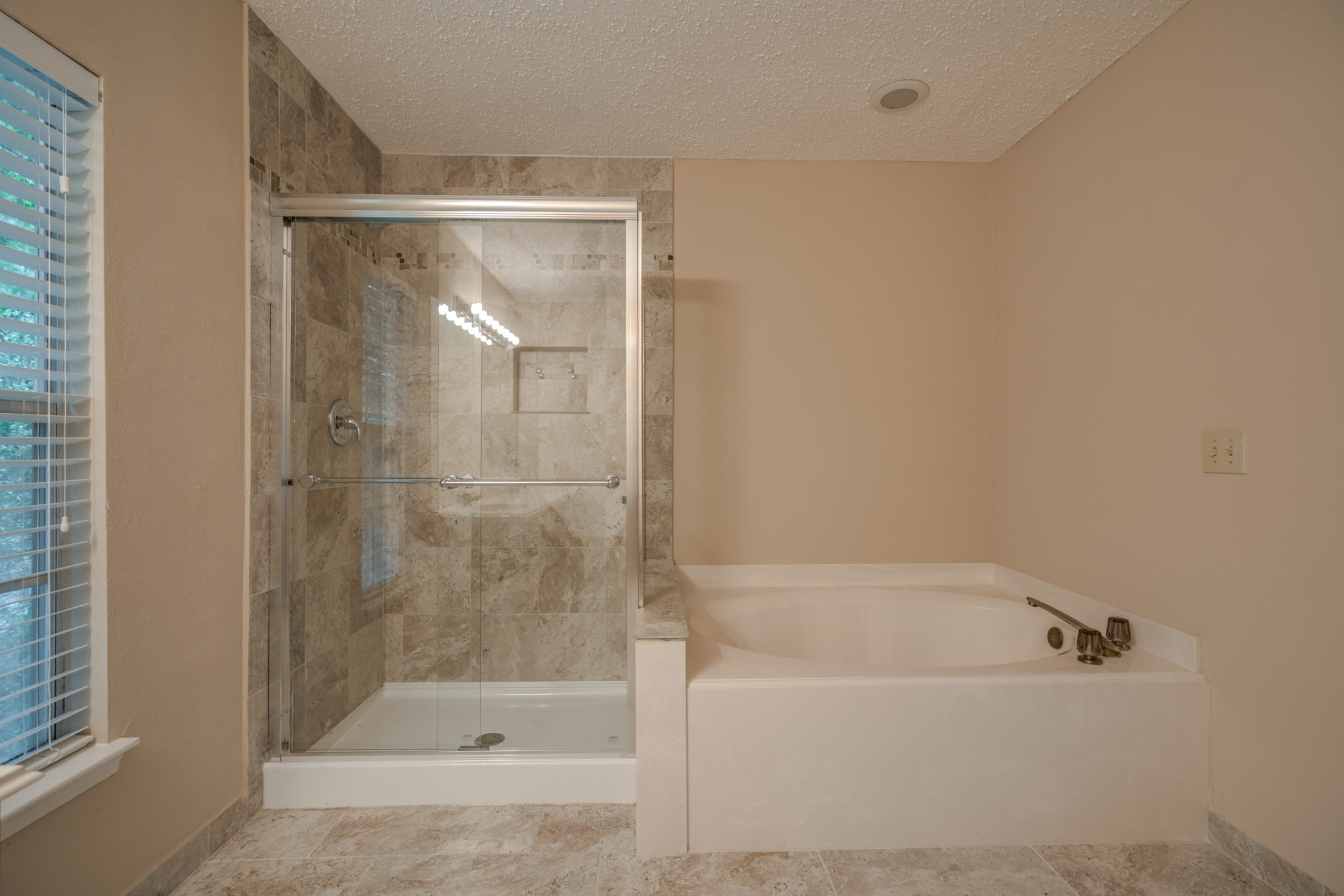 11 Robin Run Drive Spring, TX 77381 - Photo 15 of 25 a bathroom with a bathtub and a shower
