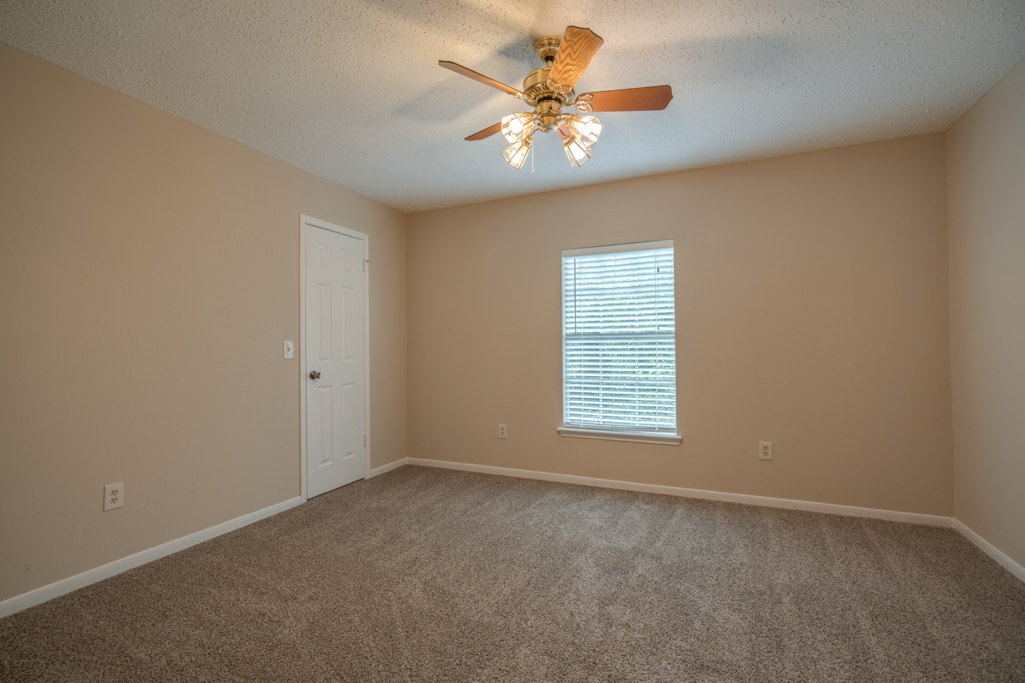 11 Robin Run Drive Spring, TX 77381 - Photo 19 of 25 an empty room with windows and fan
