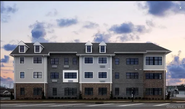 a front view of a building with lot of windows
