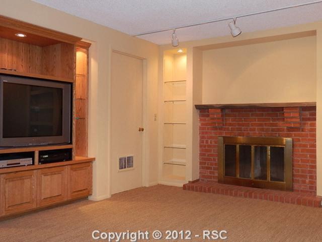 18 Mountain View Road Manitou Springs, CO 80829 - Photo 17 of 22 Fireplace and Entertainment Center in the Family Room