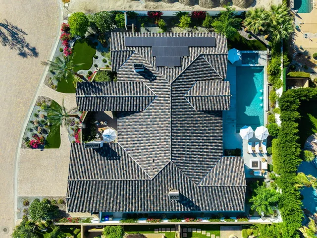 a view of a dining area with furniture and a large window