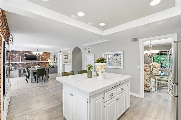 a view of dining table chairs and window