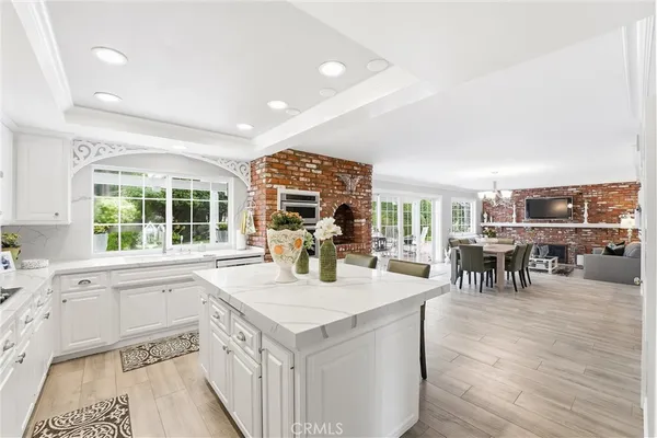 a kitchen with center island and stainless steel appliances
