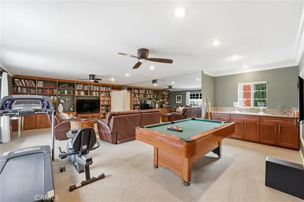 a view of a workspace with furniture and a kitchen