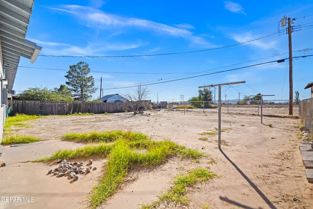a view of a backyard of the house