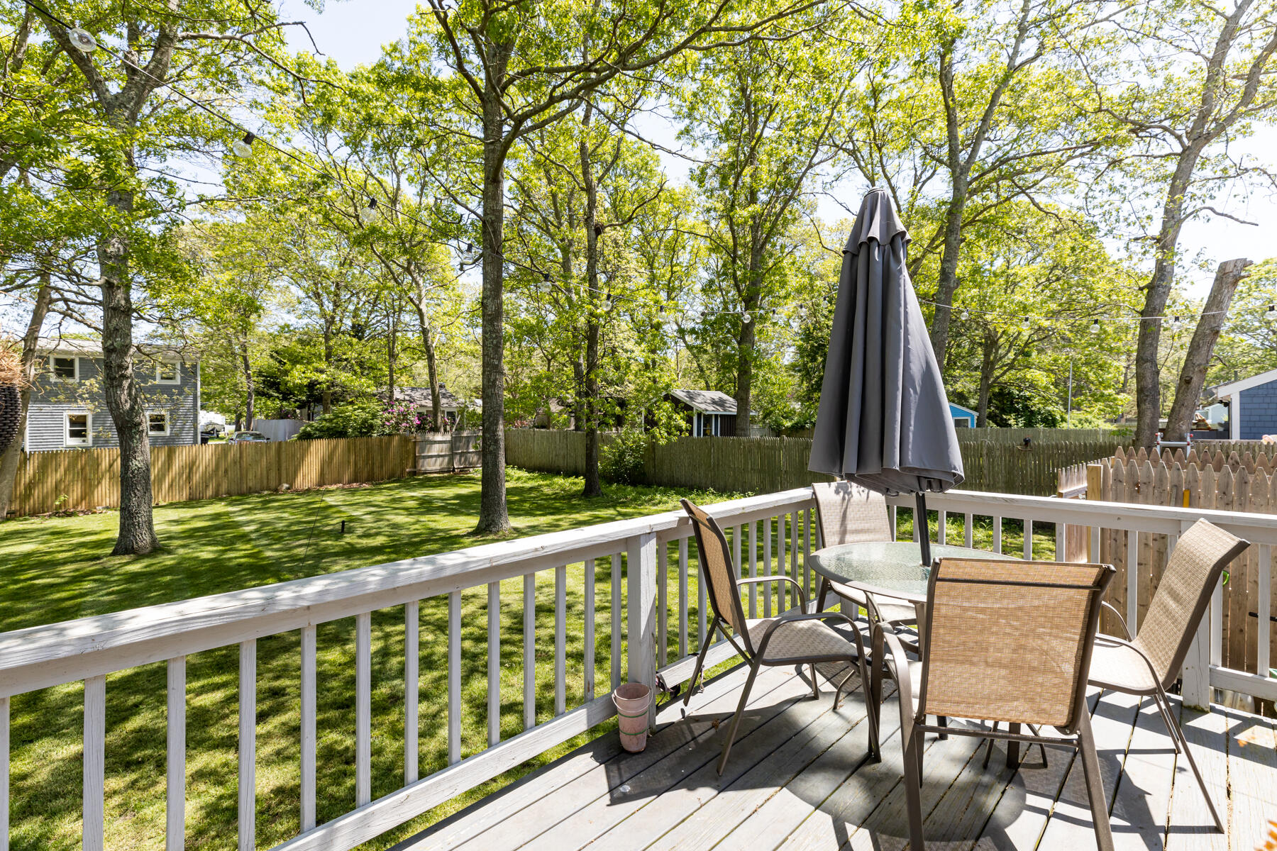 452 Lincoln Rd Extension Hyannis, MA 02601 - Photo 5 of 25 a view of deck with furniture and trees