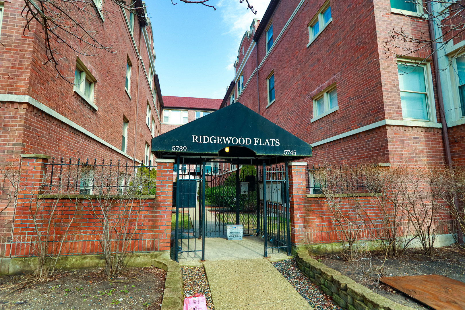 5745 North Ridge Avenue, Unit G Chicago, IL 60660 - Photo 3 of 16 a front view of a house with a garden