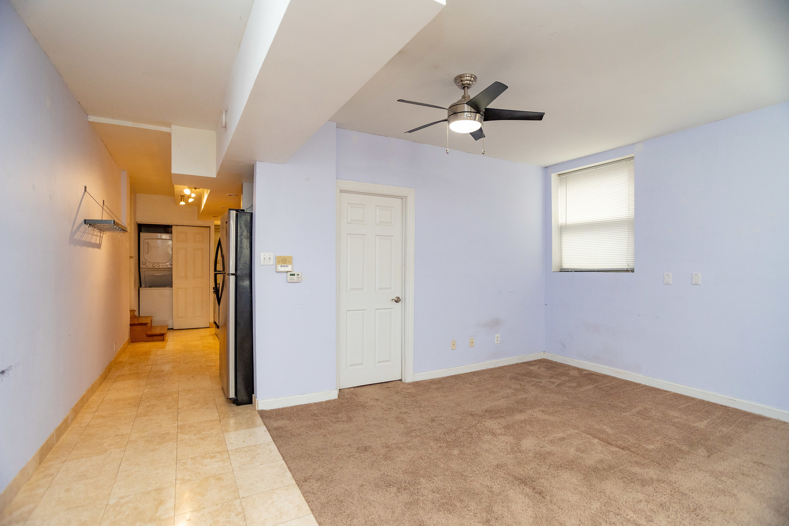5745 North Ridge Avenue, Unit G Chicago, IL 60660 - Photo 7 of 16 wooden floor in an empty room with a ceiling fan