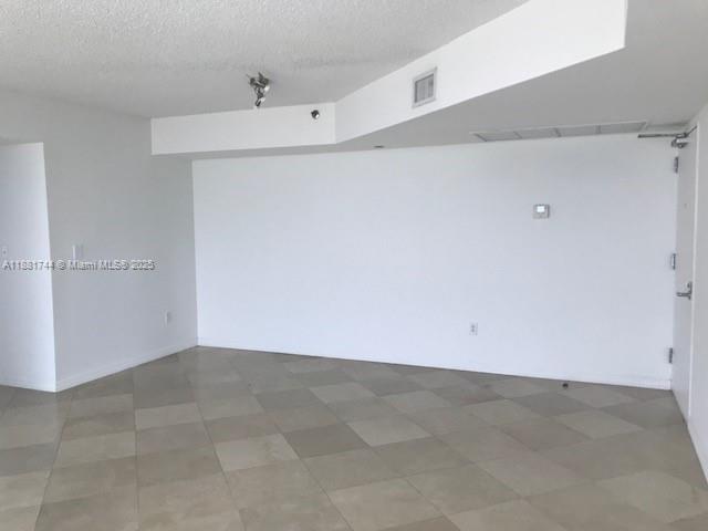 5900 Collins Avenue, Unit 1505 Miami Beach, FL 33140 - Photo 12 of 18 a view of an empty room