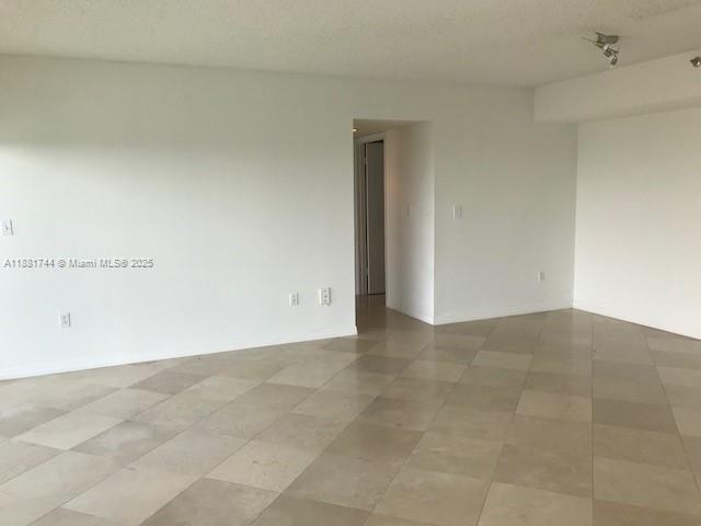 5900 Collins Avenue, Unit 1505 Miami Beach, FL 33140 - Photo 13 of 18 a view of an empty room
